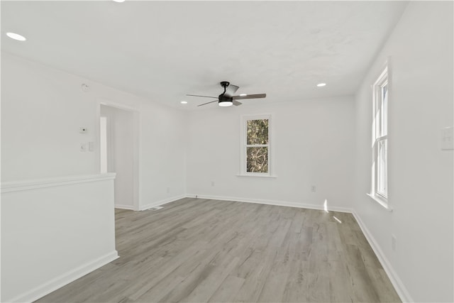 unfurnished room featuring light hardwood / wood-style flooring and ceiling fan