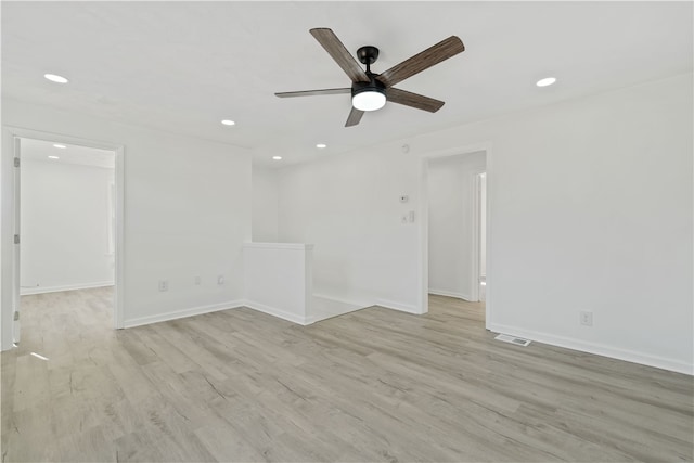 spare room featuring light hardwood / wood-style floors and ceiling fan