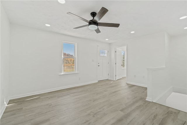 interior space featuring ceiling fan and light wood-type flooring