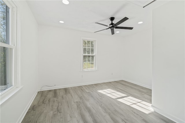 empty room with light hardwood / wood-style floors and ceiling fan