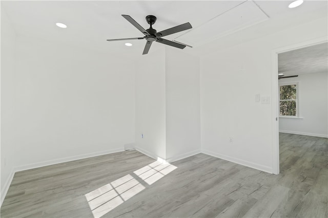 empty room with light hardwood / wood-style flooring and ceiling fan