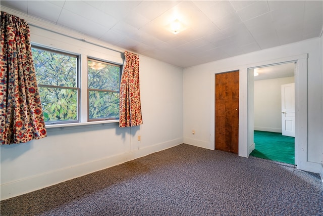 unfurnished bedroom featuring carpet flooring