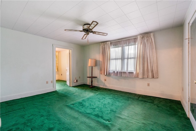 unfurnished bedroom with dark carpet and ceiling fan