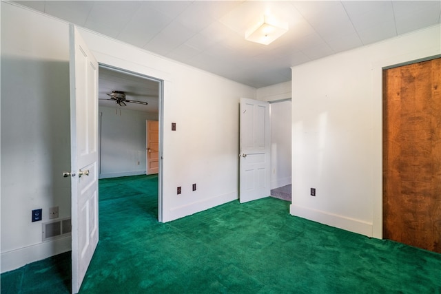 unfurnished bedroom with dark colored carpet