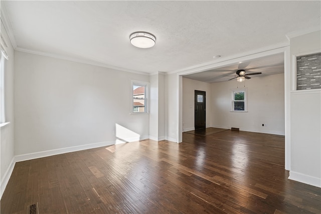 spare room featuring ceiling fan, ornamental molding, and dark hardwood / wood-style floors