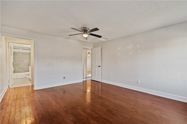 unfurnished room featuring dark hardwood / wood-style floors, a textured ceiling, and ceiling fan