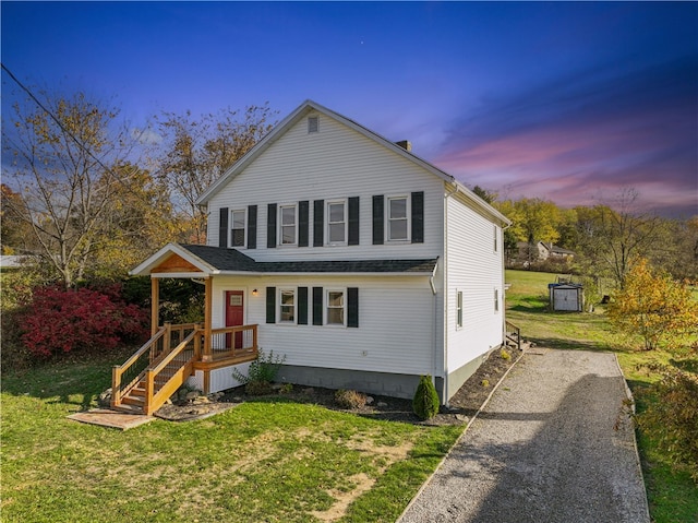 front of property featuring a lawn and a porch