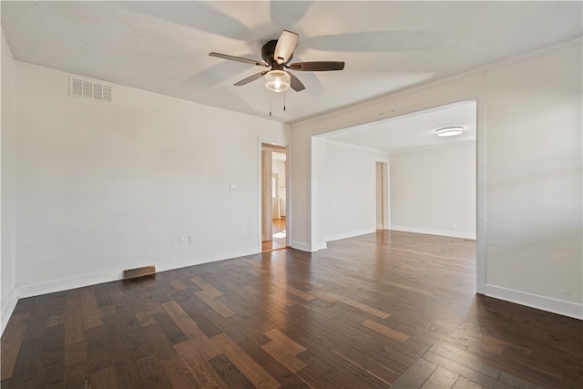 unfurnished room with ornamental molding, ceiling fan, and dark hardwood / wood-style flooring