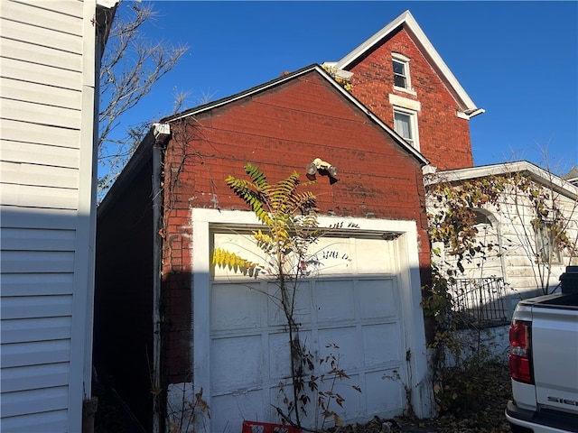 view of property exterior with a garage