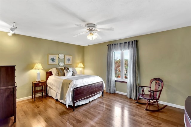 bedroom featuring ceiling fan and hardwood / wood-style floors