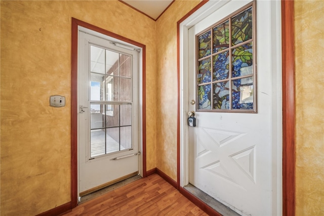 entryway with hardwood / wood-style flooring