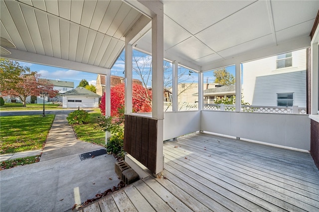 deck with covered porch and a garage