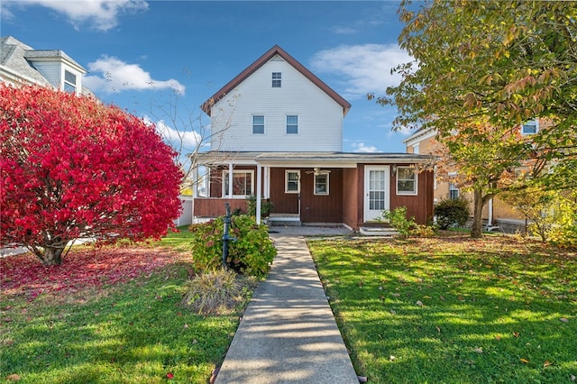 view of front of home featuring a porch and a front lawn