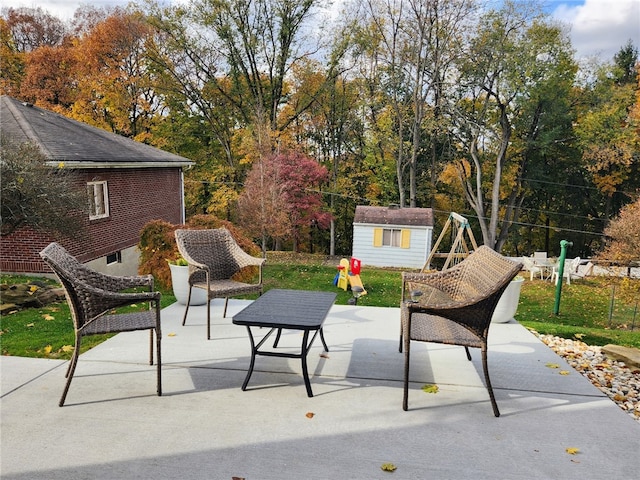 view of patio / terrace with a storage shed