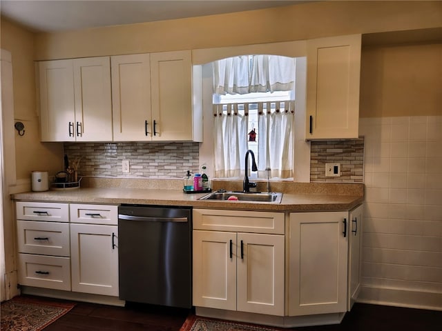 kitchen featuring sink, white cabinetry, dishwasher, and dark hardwood / wood-style floors