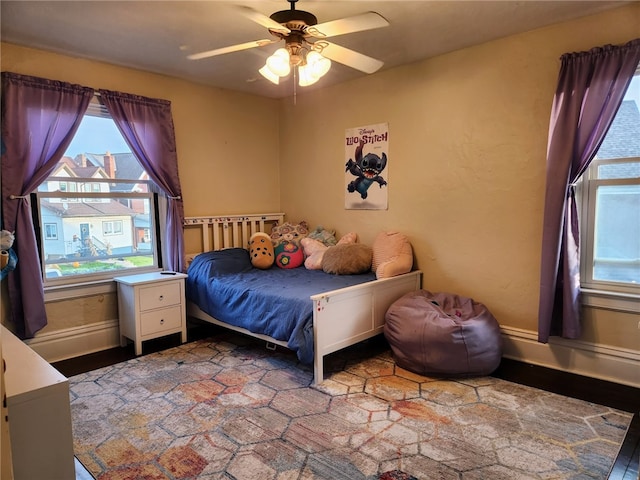 bedroom featuring wood-type flooring and ceiling fan