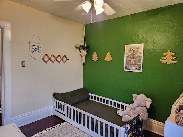 bedroom with wood-type flooring and ceiling fan