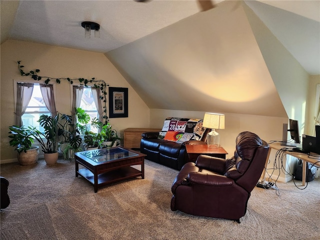 carpeted living room featuring lofted ceiling