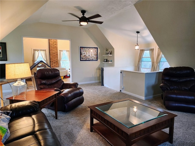 living room with lofted ceiling, carpet floors, and ceiling fan