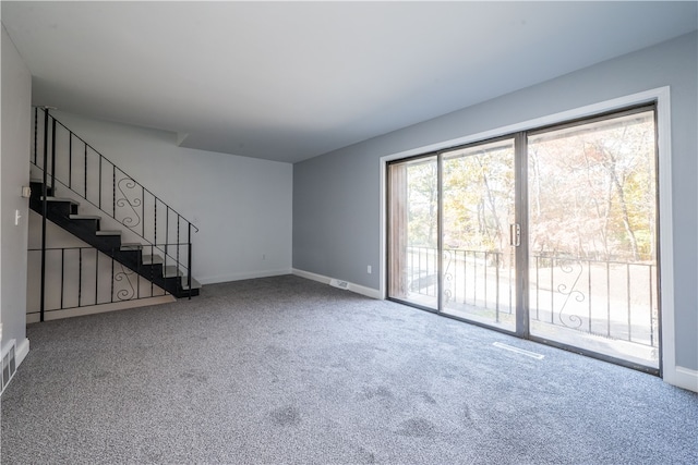 unfurnished living room with carpet