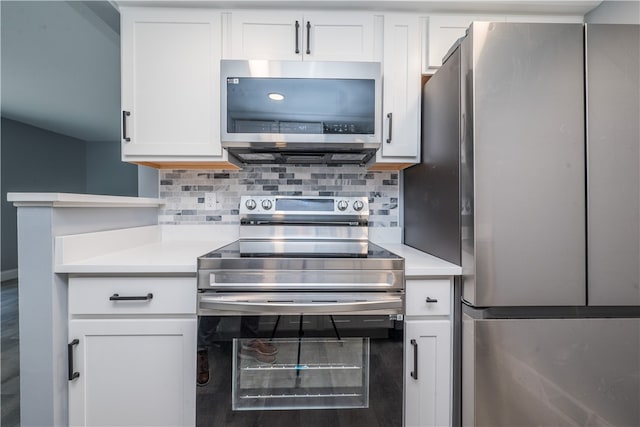 kitchen with white cabinetry, backsplash, and appliances with stainless steel finishes