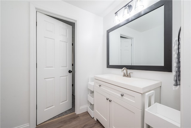 bathroom featuring vanity and hardwood / wood-style flooring