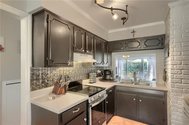 kitchen featuring stainless steel range with electric stovetop, decorative backsplash, dark brown cabinetry, and sink