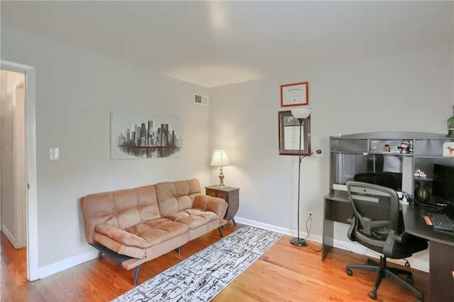 office with wood-type flooring