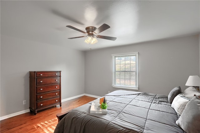 bedroom featuring light wood-type flooring and ceiling fan