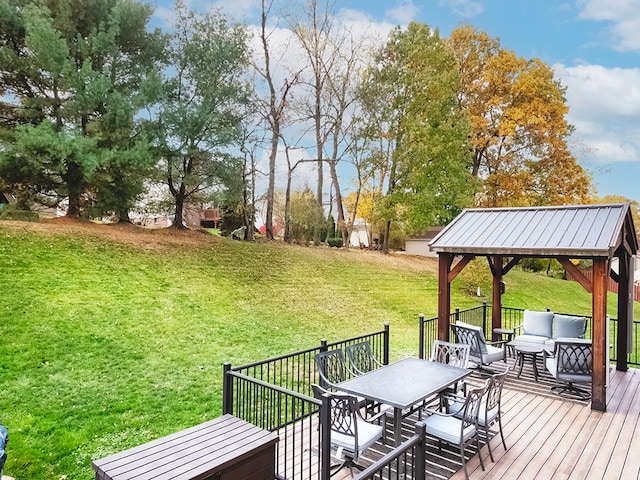 wooden deck with a gazebo, a lawn, and an outdoor hangout area