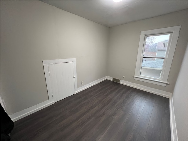 empty room featuring dark hardwood / wood-style floors