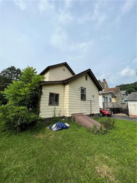 view of home's exterior featuring a lawn