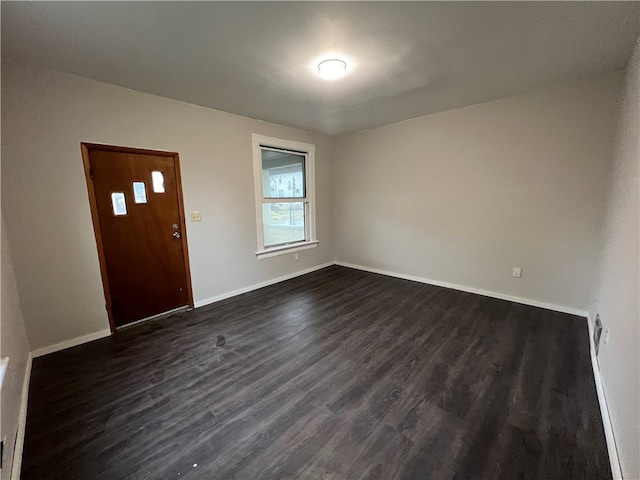 foyer entrance featuring dark hardwood / wood-style floors