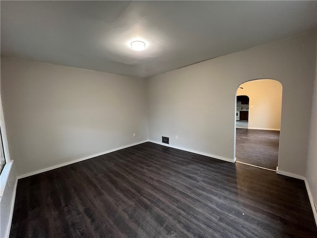 empty room featuring dark hardwood / wood-style floors