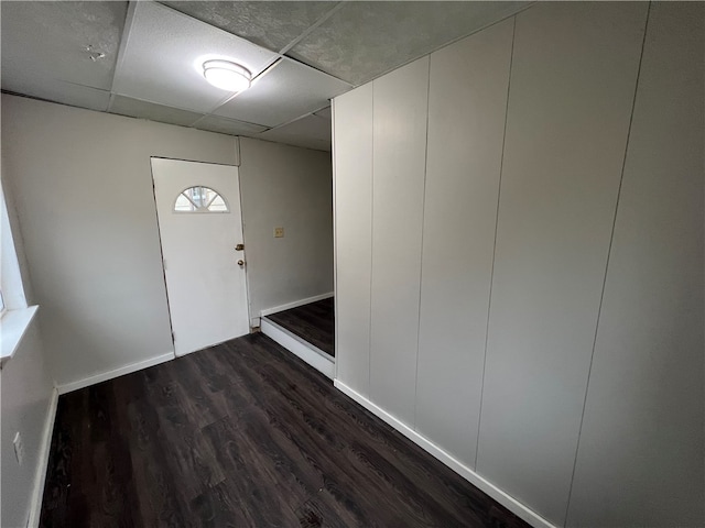 foyer with dark hardwood / wood-style floors