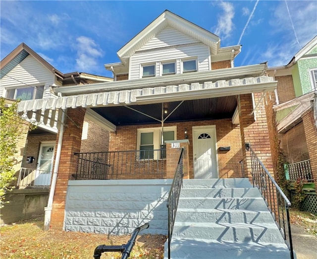 view of property featuring a porch