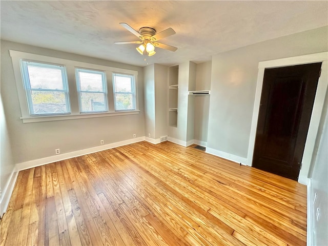 unfurnished bedroom featuring light hardwood / wood-style floors, a closet, a textured ceiling, and ceiling fan