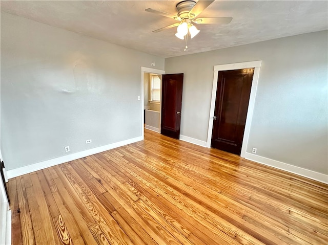 unfurnished bedroom with a closet, light hardwood / wood-style floors, and ceiling fan