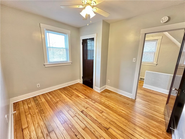 unfurnished bedroom with light wood-type flooring and ceiling fan