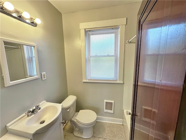 bathroom featuring a shower with door, tile patterned floors, heating unit, and toilet