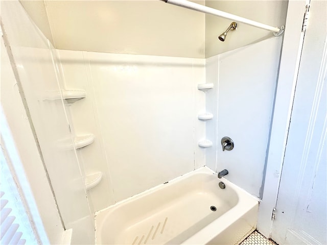 bathroom with tile patterned floors and shower / bathing tub combination