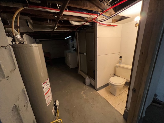 basement with gas water heater and washing machine and dryer