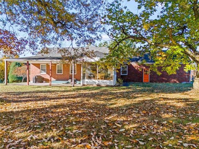 rear view of house featuring a patio