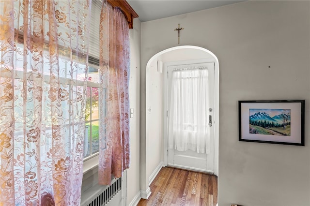 doorway to outside with light wood-type flooring