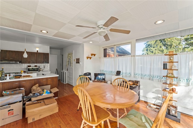 dining space featuring light hardwood / wood-style floors and ceiling fan