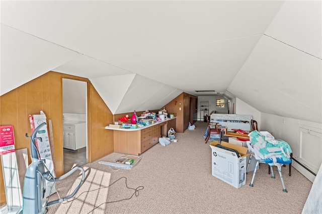 game room with light carpet, a healthy amount of sunlight, vaulted ceiling, and wooden walls