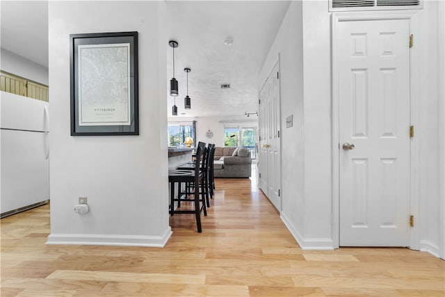 hall featuring light wood-type flooring