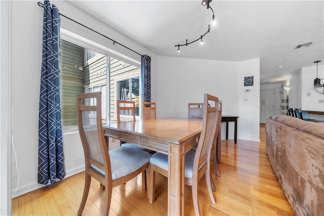 dining area with light wood-type flooring