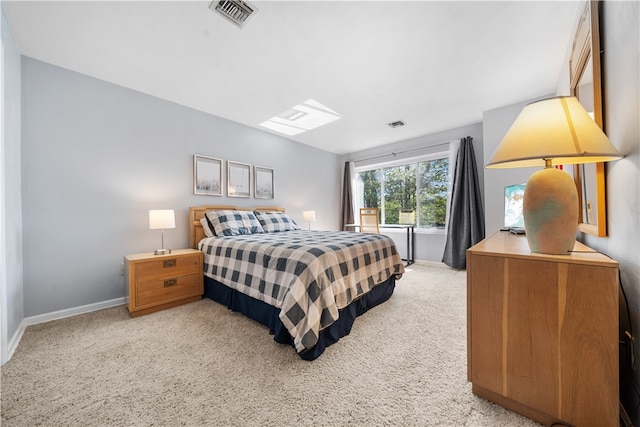 bedroom featuring light colored carpet