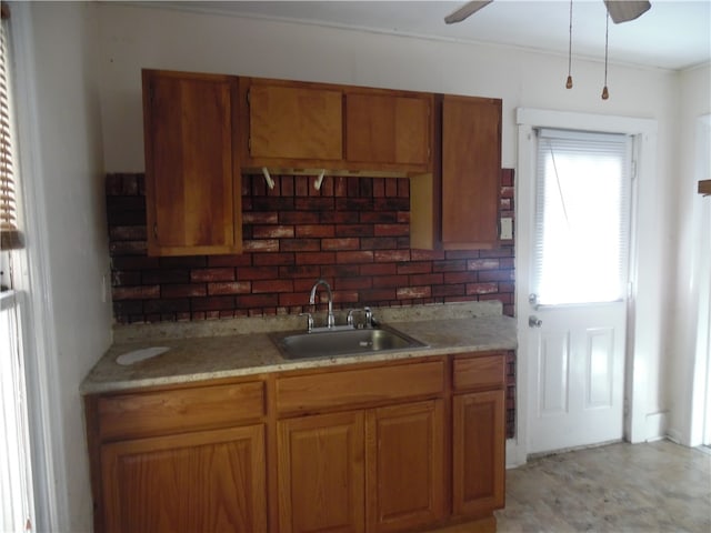 kitchen with decorative backsplash, sink, and ceiling fan